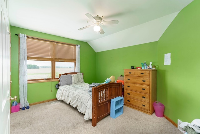 2211 N Kerby Rd, Owosso, MI 48867 - bedroom with carpet flooring, baseboards, lofted ceiling, and ceiling fan