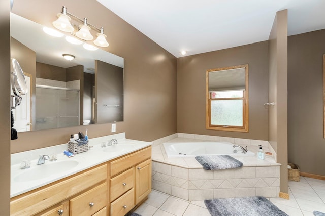 2211 N Kerby Rd, Owosso, MI 48867 - bathroom with tile patterned floors, a bath, a shower stall, and double vanity