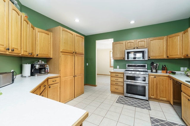 2211 N Kerby Rd, Owosso, MI 48867 - kitchen featuring stainless steel appliances, light countertops, light tile patterned floors, and recessed lighting