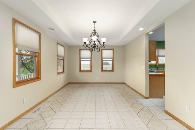 2211 N Kerby Rd, Owosso, MI 48867 - spare room with a chandelier, recessed lighting, baseboards, and light tile patterned floors
