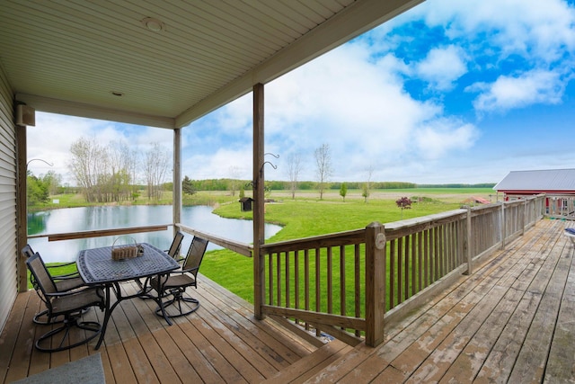 2211 N Kerby Rd, Owosso, MI 48867 - wooden terrace featuring a water view, a yard, and outdoor dining area