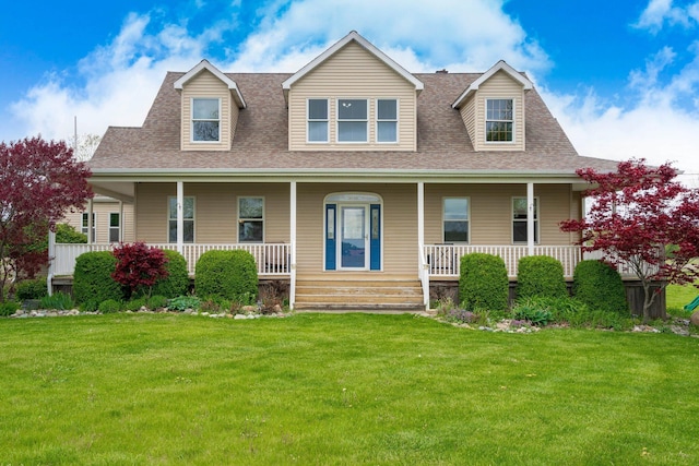 2211 N Kerby Rd, Owosso, MI 48867 - view of front of property with a front lawn, a shingled roof, and a porch