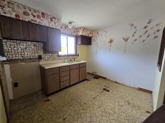 kitchen with a sink and light countertops