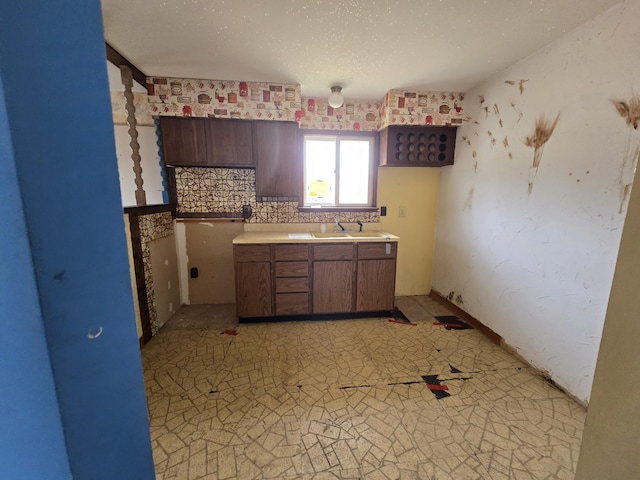 kitchen with a sink and light countertops