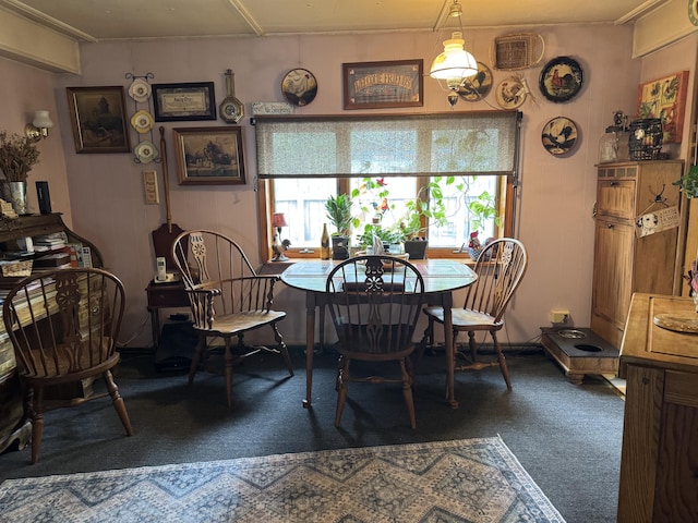 dining room with carpet flooring and a wealth of natural light