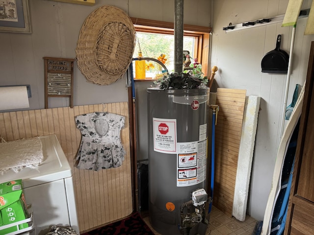 utilities featuring washer / dryer and gas water heater