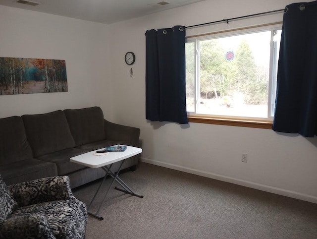 carpeted living room with baseboards and visible vents