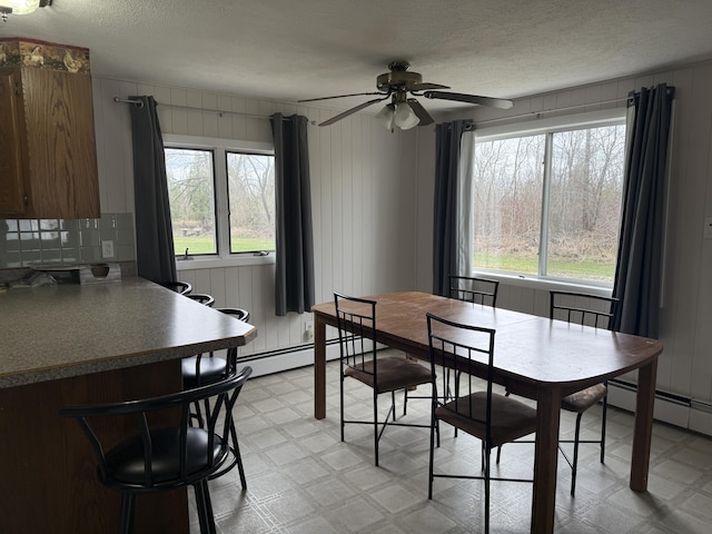 1393 Mackinaw Ave, Cheboygan, MI 49721 - dining area with a ceiling fan, a healthy amount of sunlight, and light floors