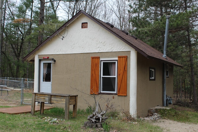 view of property exterior with fence