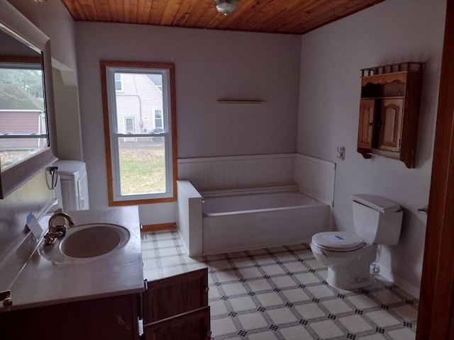 full bathroom featuring toilet, baseboards, a healthy amount of sunlight, and wooden ceiling