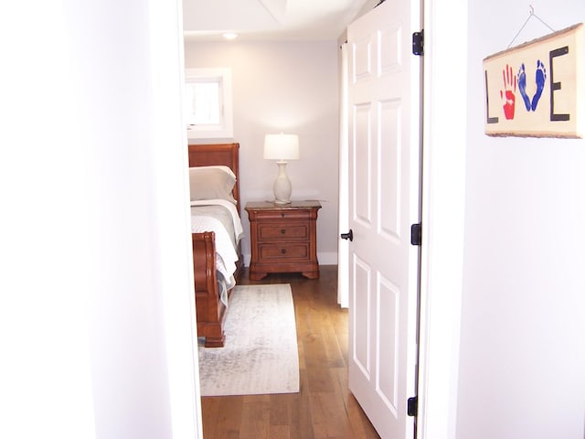 bedroom featuring wood finished floors