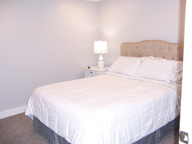 carpeted bedroom with baseboards
