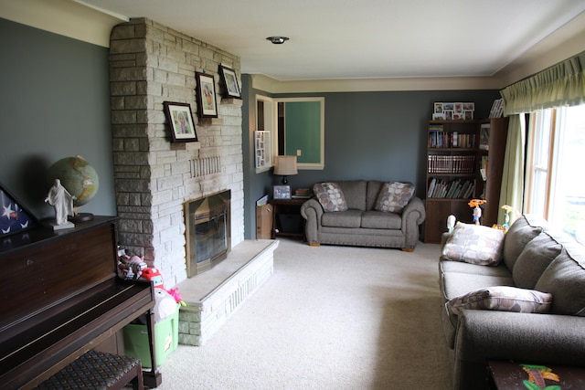 carpeted living area with a stone fireplace