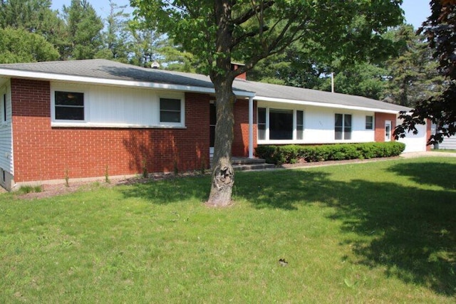 567 Long Rapids Rd, Alpena, MI 49707 - ranch-style home featuring brick siding and a front lawn