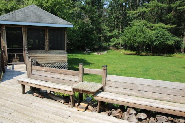 567 Long Rapids Rd, Alpena, MI 49707 - wooden deck with a yard and a sunroom