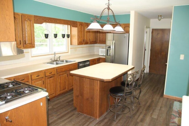 567 Long Rapids Rd, Alpena, MI 49707 - kitchen with stainless steel fridge, dark wood finished floors, a kitchen island, and dishwashing machine