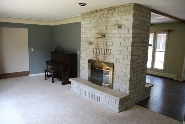 567 Long Rapids Rd, Alpena, MI 49707 - carpeted living room featuring a stone fireplace and baseboards