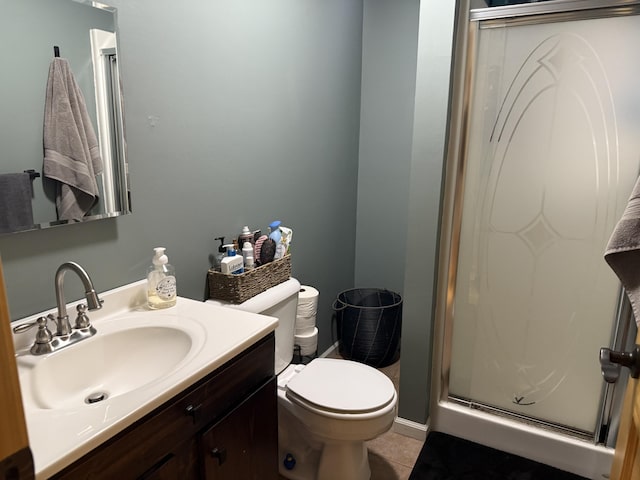 3140 Kitchen Rd, Cheboygan, MI 49721 - full bathroom featuring a stall shower, vanity, toilet, and tile patterned floors