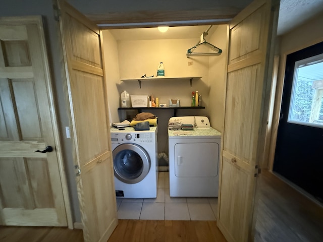 3140 Kitchen Rd, Cheboygan, MI 49721 - laundry room featuring washer and clothes dryer, laundry area, and light wood-type flooring