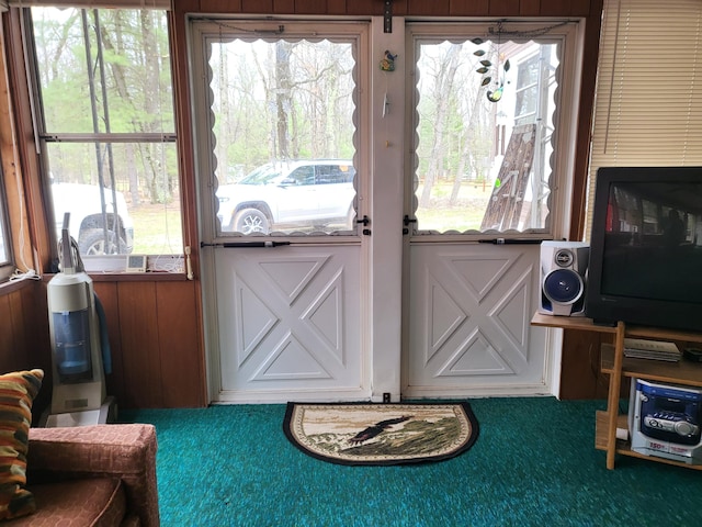 10675 N Shady Ln, Irons, MI 49644 - doorway to outside featuring carpet and a wealth of natural light