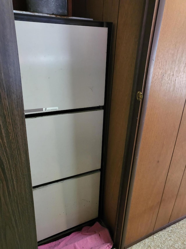 10675 N Shady Ln, Irons, MI 49644 - room details featuring freestanding refrigerator