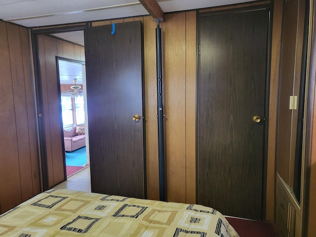 10675 N Shady Ln, Irons, MI 49644 - bedroom with wood walls