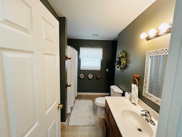 full bathroom featuring tile patterned floors, toilet, visible vents, and vanity