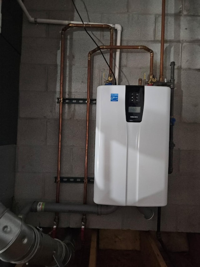 utility room with tankless water heater