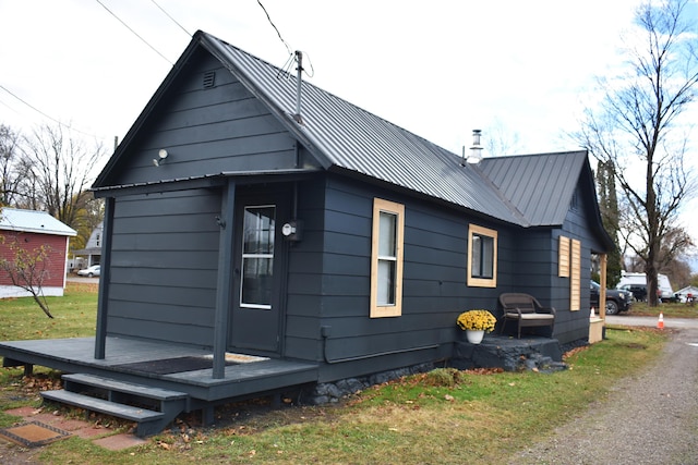 3785 S 2nd St, Onaway, MI 49765 - view of side of property with metal roof