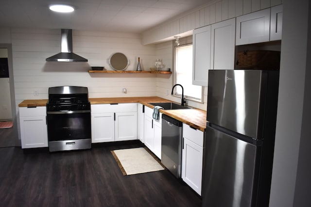 3785 S 2nd St, Onaway, MI 49765 - kitchen with a sink, wood counters, open shelves, stainless steel appliances, and wall chimney range hood