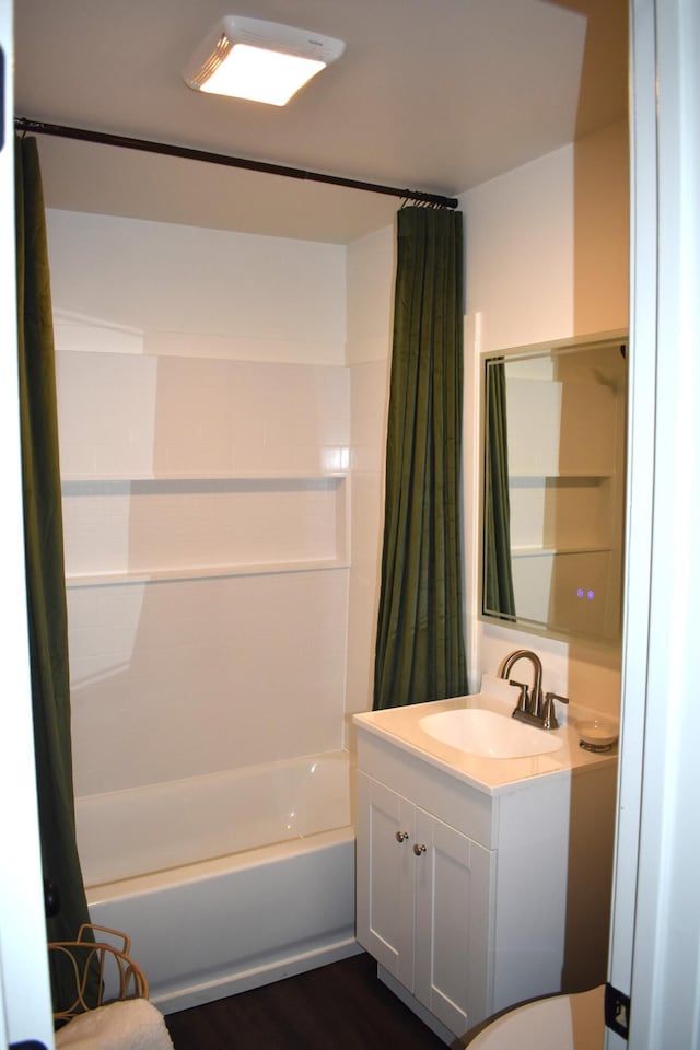 3785 S 2nd St, Onaway, MI 49765 - full bath with vanity, shower / tub combo, and wood finished floors