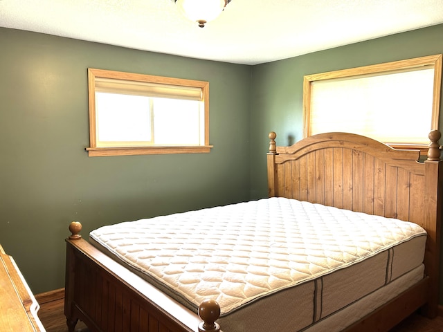 bedroom with wood finished floors