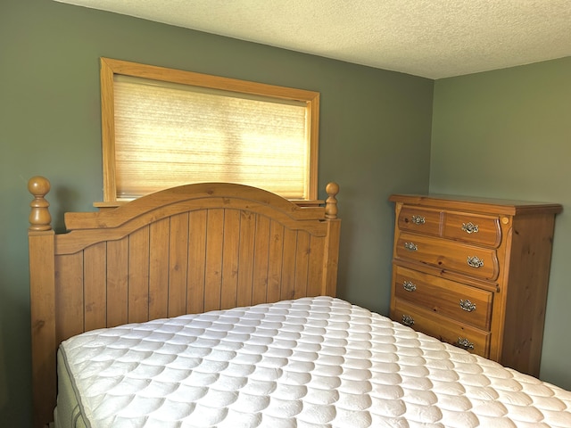 bedroom featuring a textured ceiling