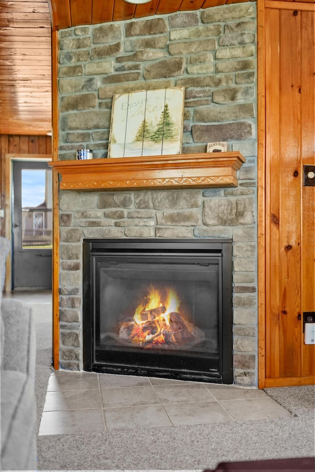 135 Alpena Trl, Houghton Lake, MI 48629 - detailed view of a stone fireplace, wood ceiling, and wood walls