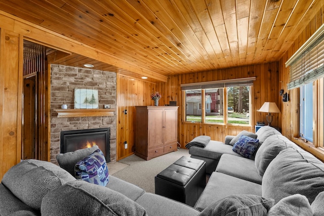 135 Alpena Trl, Houghton Lake, MI 48629 - living room with wood walls, wooden ceiling, light colored carpet, and a fireplace