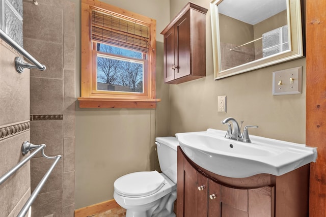 135 Alpena Trl, Houghton Lake, MI 48629 - full bathroom featuring toilet, vanity, and tiled shower