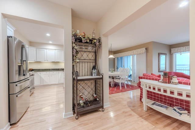 dining room featuring light wood-style floors and recessed lighting
