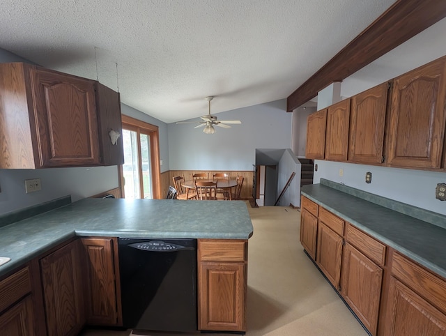 kitchen featuring dishwasher, a textured ceiling, a ceiling fan, a peninsula, and brown cabinetry