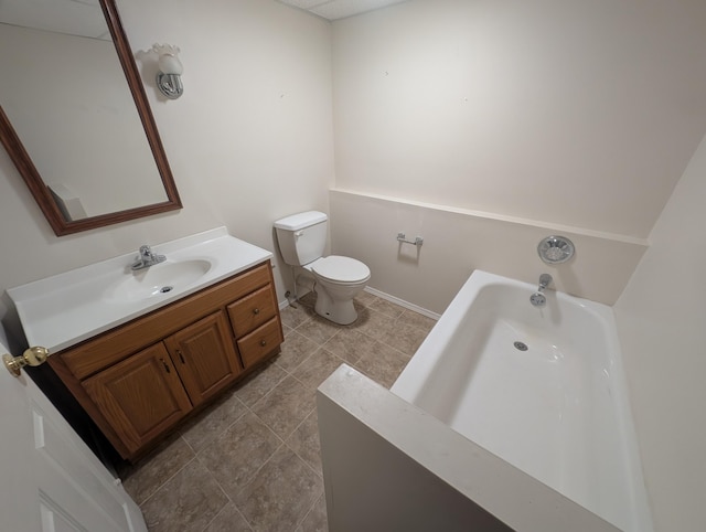 bathroom featuring a garden tub, toilet, vanity, and tile patterned floors