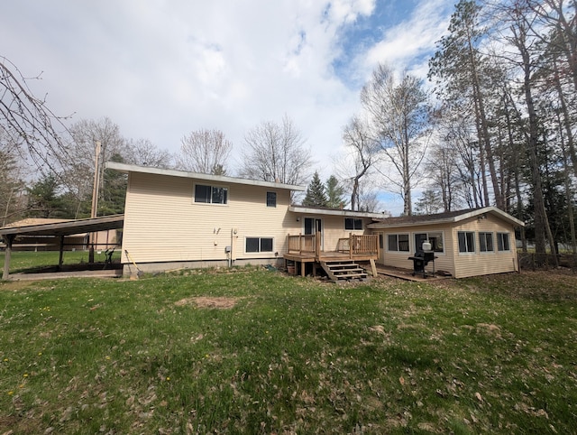 rear view of property with a deck and a yard
