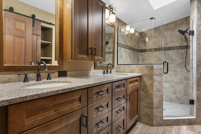1505 Shawnee Dr, Indian River, MI 49749 - bathroom with double vanity and a stall shower