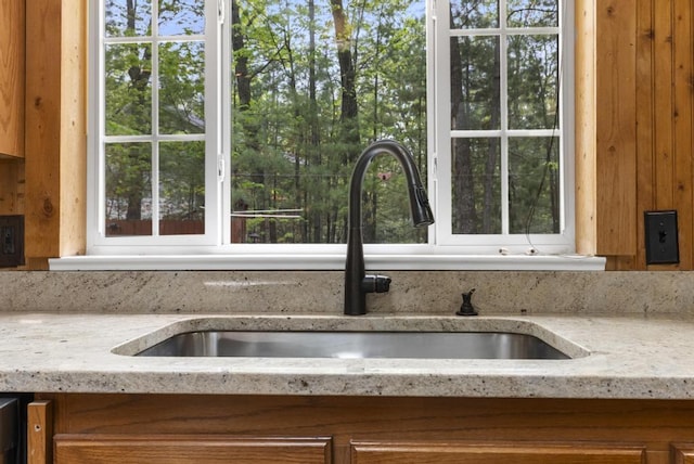 1505 Shawnee Dr, Indian River, MI 49749 - kitchen with a sink, healthy amount of natural light, and light stone countertops