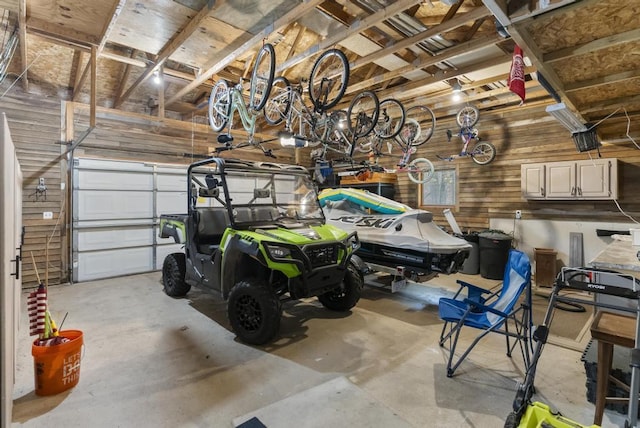 1505 Shawnee Dr, Indian River, MI 49749 - garage featuring wood walls