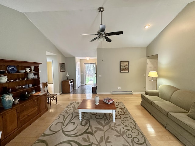 1243 Euclid Ave, Grayling, MI 49738 - living room featuring lofted ceiling, ceiling fan, baseboard heating, light wood-style flooring, and baseboards