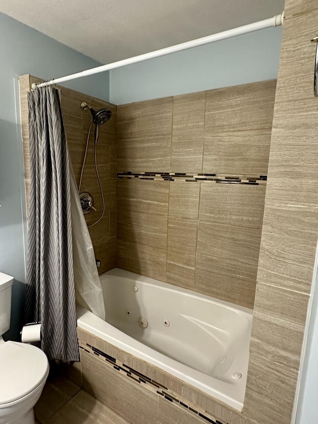 1243 Euclid Ave, Grayling, MI 49738 - bathroom featuring toilet and a combined bath / shower with jetted tub