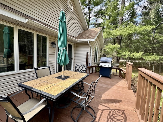 1243 Euclid Ave, Grayling, MI 49738 - wooden deck with outdoor dining space and area for grilling