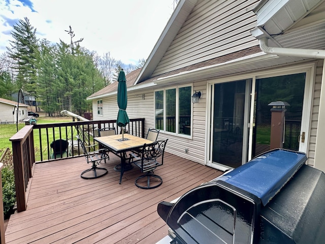 1243 Euclid Ave, Grayling, MI 49738 - wooden deck with outdoor dining area