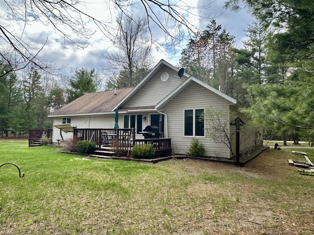 1243 Euclid Ave, Grayling, MI 49738 - back of house featuring a deck and a yard