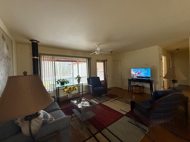 206 Great Oak Dr, Roscommon, MI 48653 - living room featuring a ceiling fan