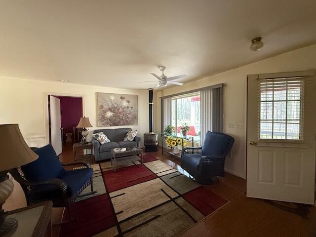 206 Great Oak Dr, Roscommon, MI 48653 - living room with a ceiling fan and a wood stove